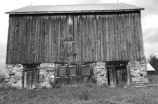 Back view of barn showing foundation stonework.